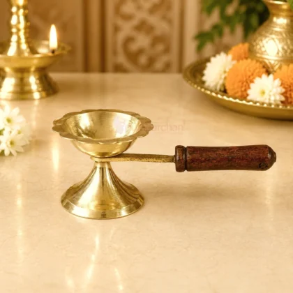 Premium brass loban guggal dhoop burner with wooden handle for burning sambrani, camphor and incense during daily puja, havan and temple rituals.