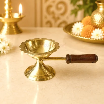 Premium brass loban guggal dhoop burner with wooden handle for burning sambrani, camphor and incense during daily puja, havan and temple rituals.