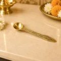 Premium brass pooja spoon with engraved floral handle for Panchpatra, Gangajal, Panchamrit, Jal Abhishek and daily worship.