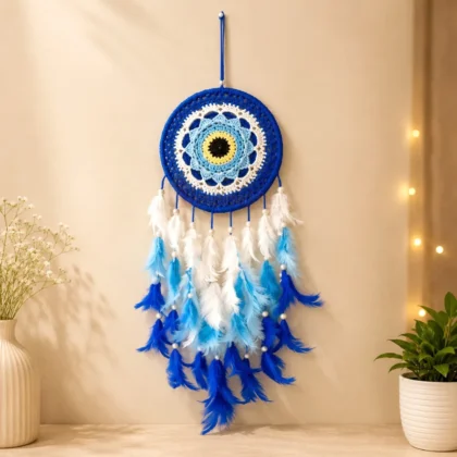Handmade blue evil eye dream catcher wall hanging with blue and white feathers for home décor and positive energy.
